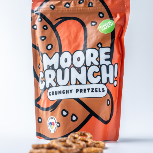 A package of Moore Crunch! Garlic Ranch pretzels with the product visible just below the package.